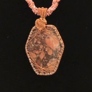 Wire wrapped stone with glass beads